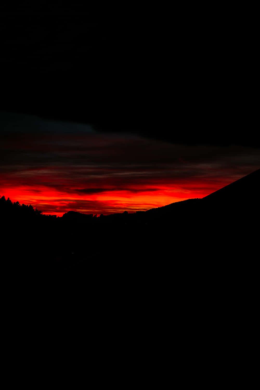 A red sunset over the mountains - Dark red