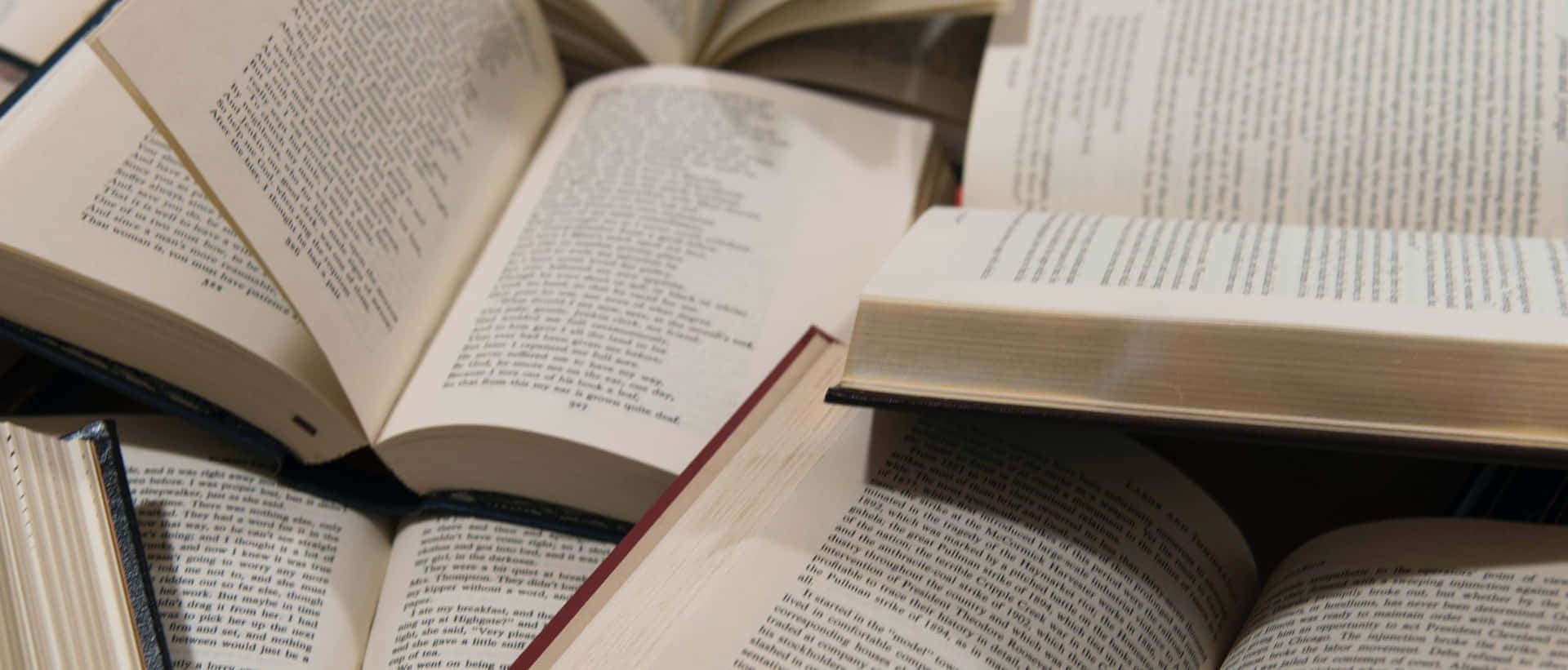 Download A Pile Of Books On A Table