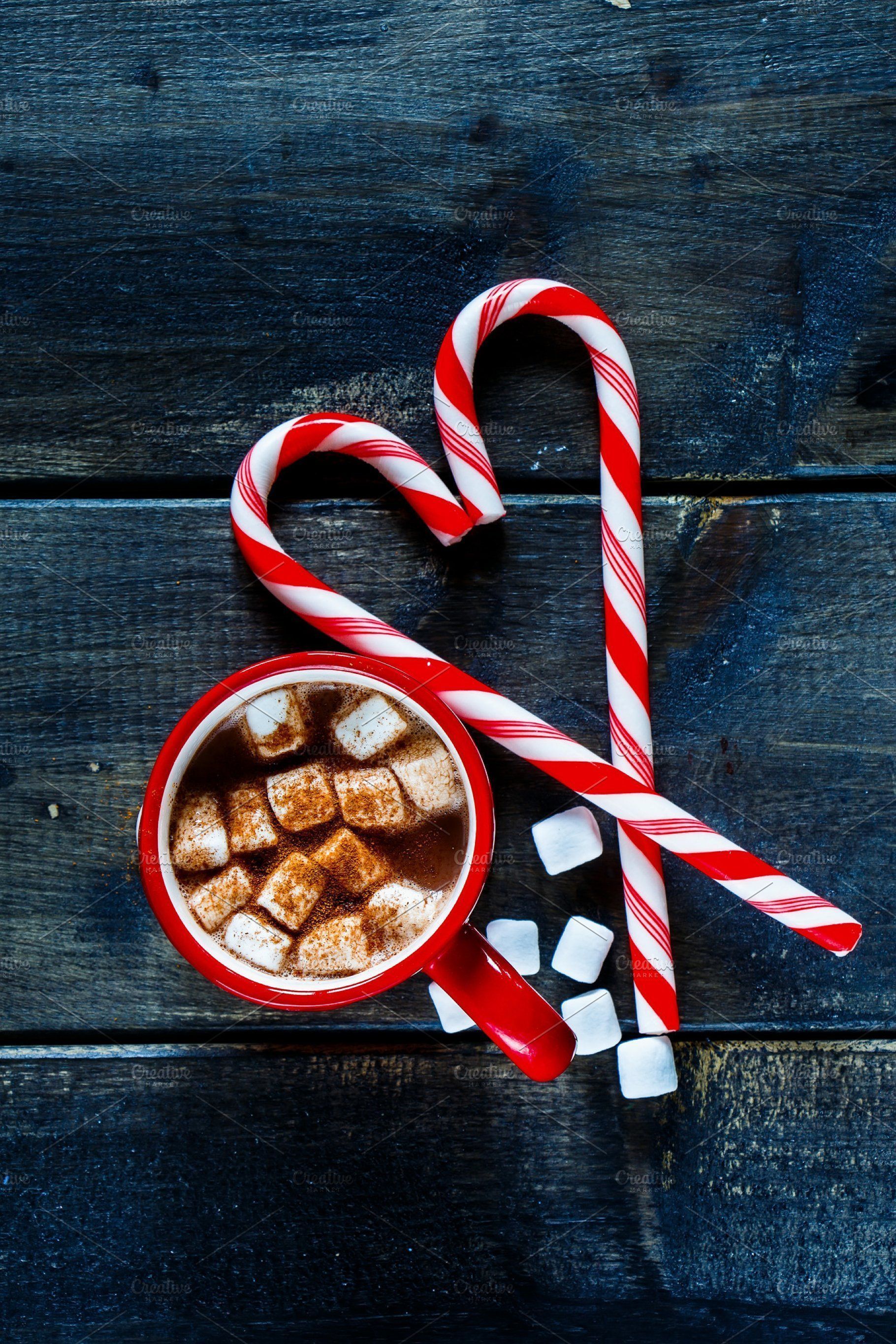 A cup of hot chocolate with candy canes - Candy cane, chocolate, candy, marshmallows