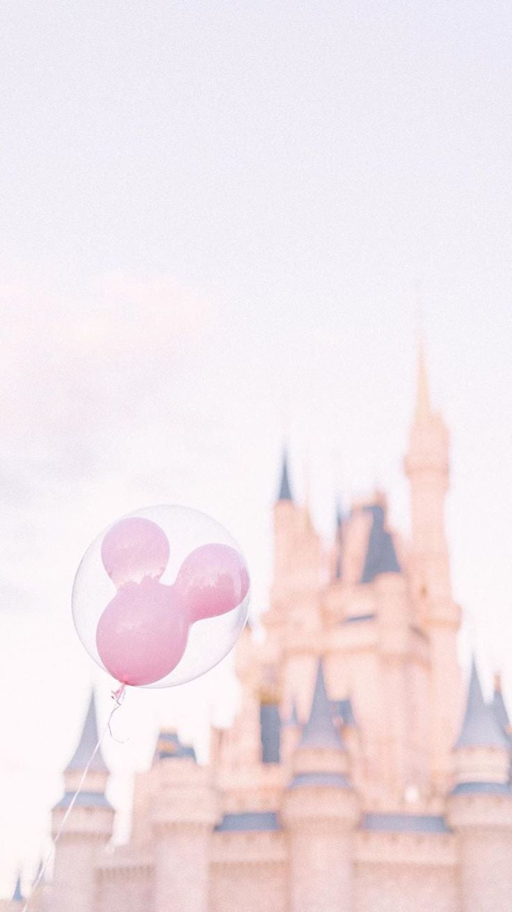 Pink balloons in front of a Disney castle - Disney, Disneyland