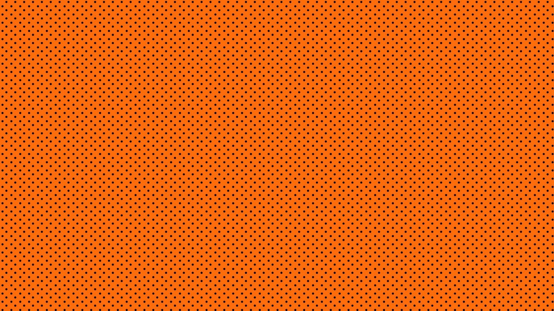 An orange background with small white dots - Dark orange