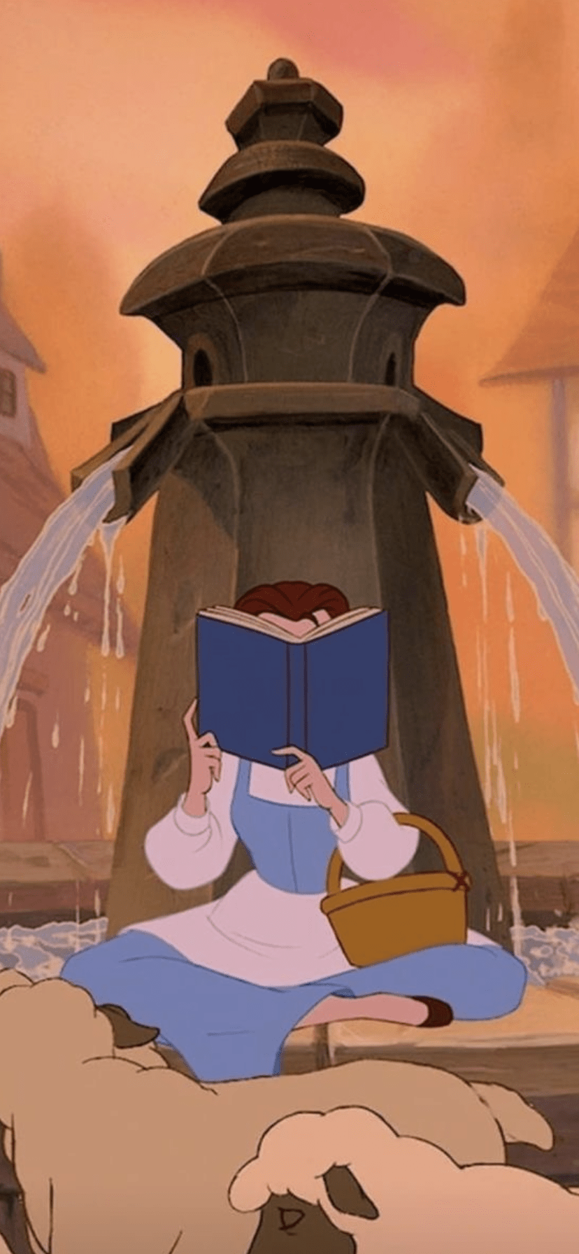 Belle reading a book in front of a fountain in the animated movie 
