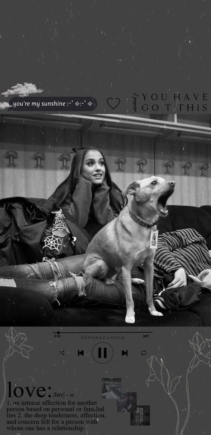 A woman sitting on the couch with her dog - Ariana Grande, gray