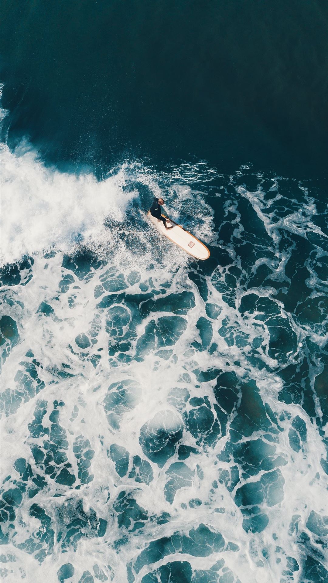 Aerial view of a surfer riding a wave - Surf, wave
