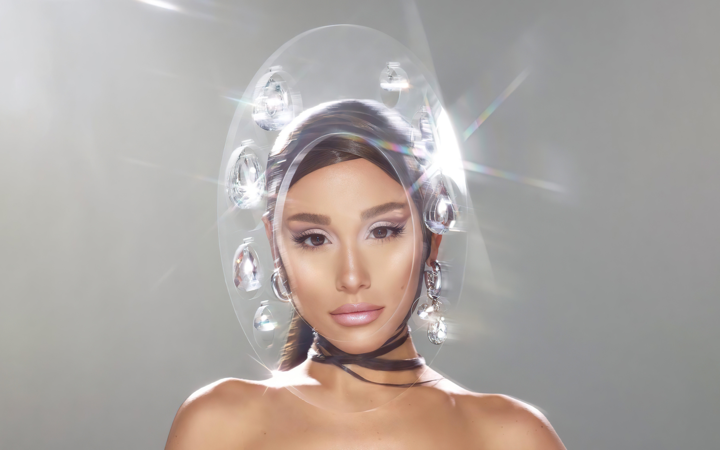 A woman wearing an acrylic headpiece - Ariana Grande