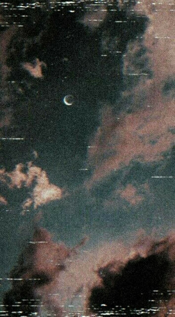 A moon in the sky with clouds - VHS
