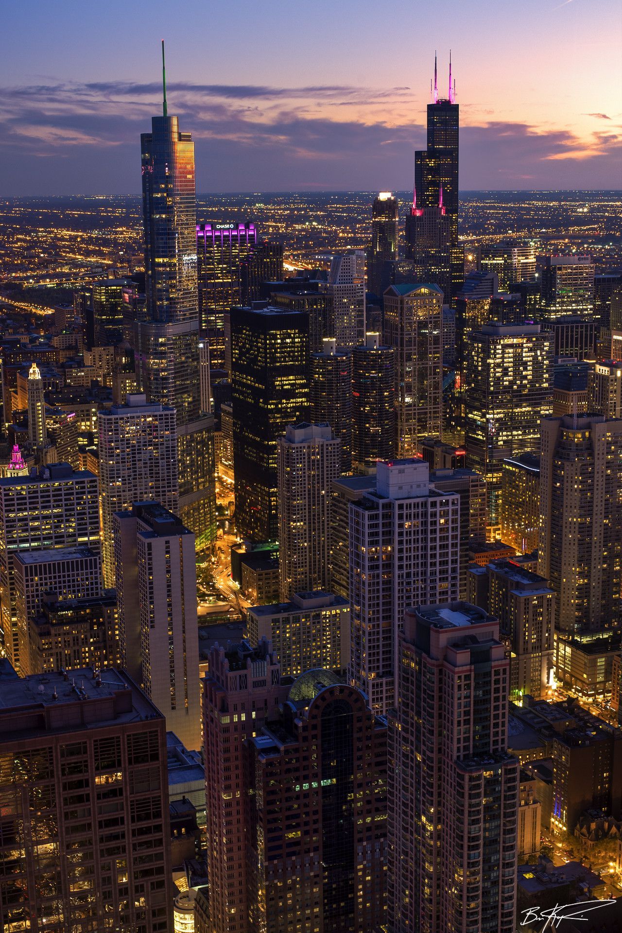 A city skyline at night with buildings and lights - Chicago
