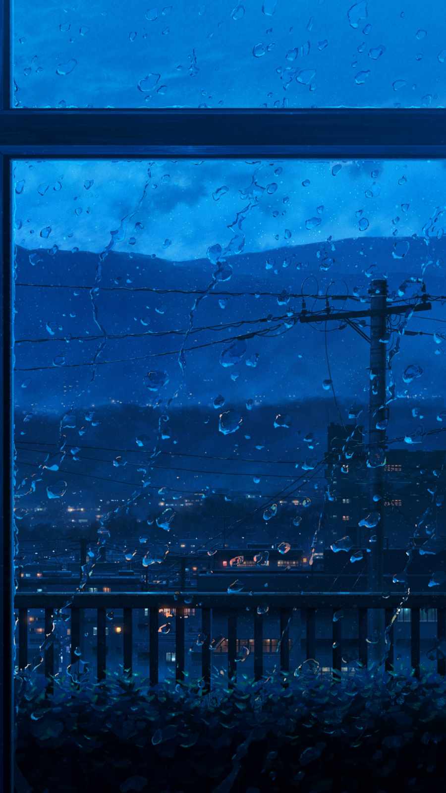 A window with rain on it and mountains in the background - Rain