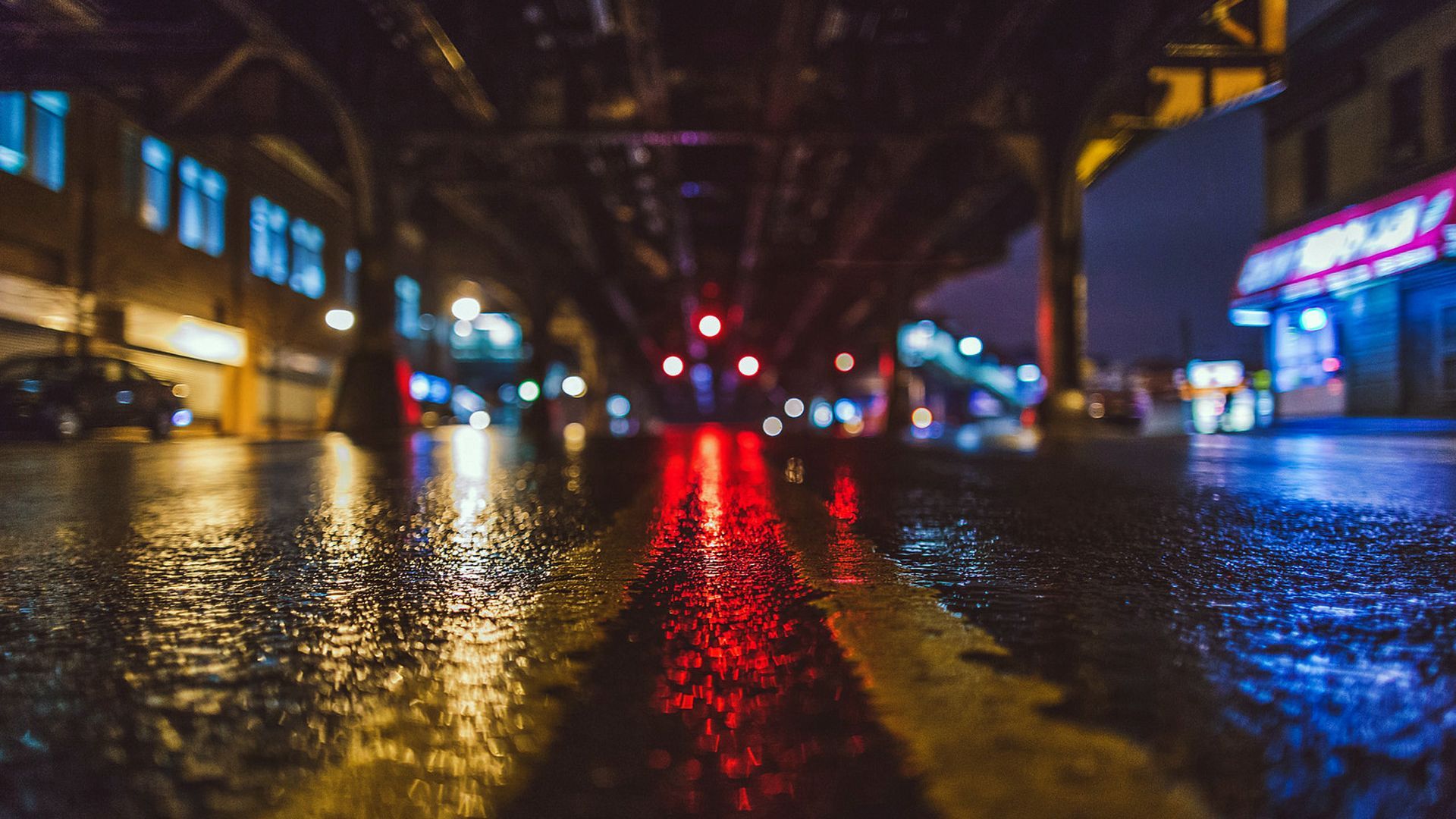 A street with red lights at night - Rain, New York