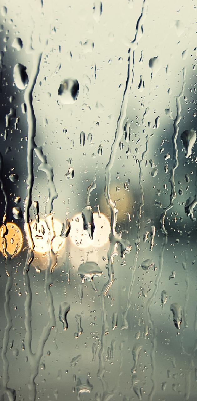 A window with rain droplets on it - Rain