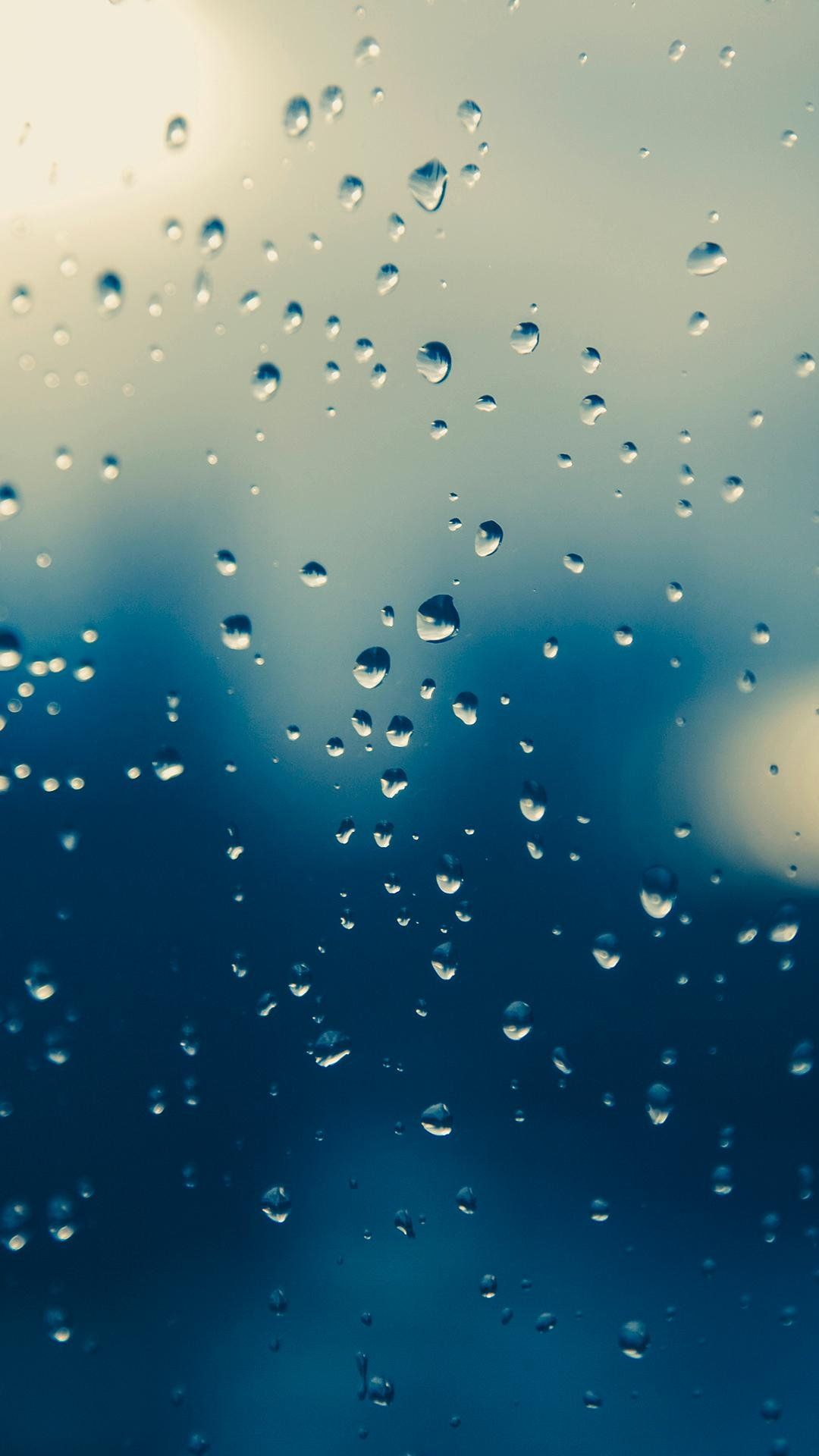 A close up of raindrops on the window - Rain