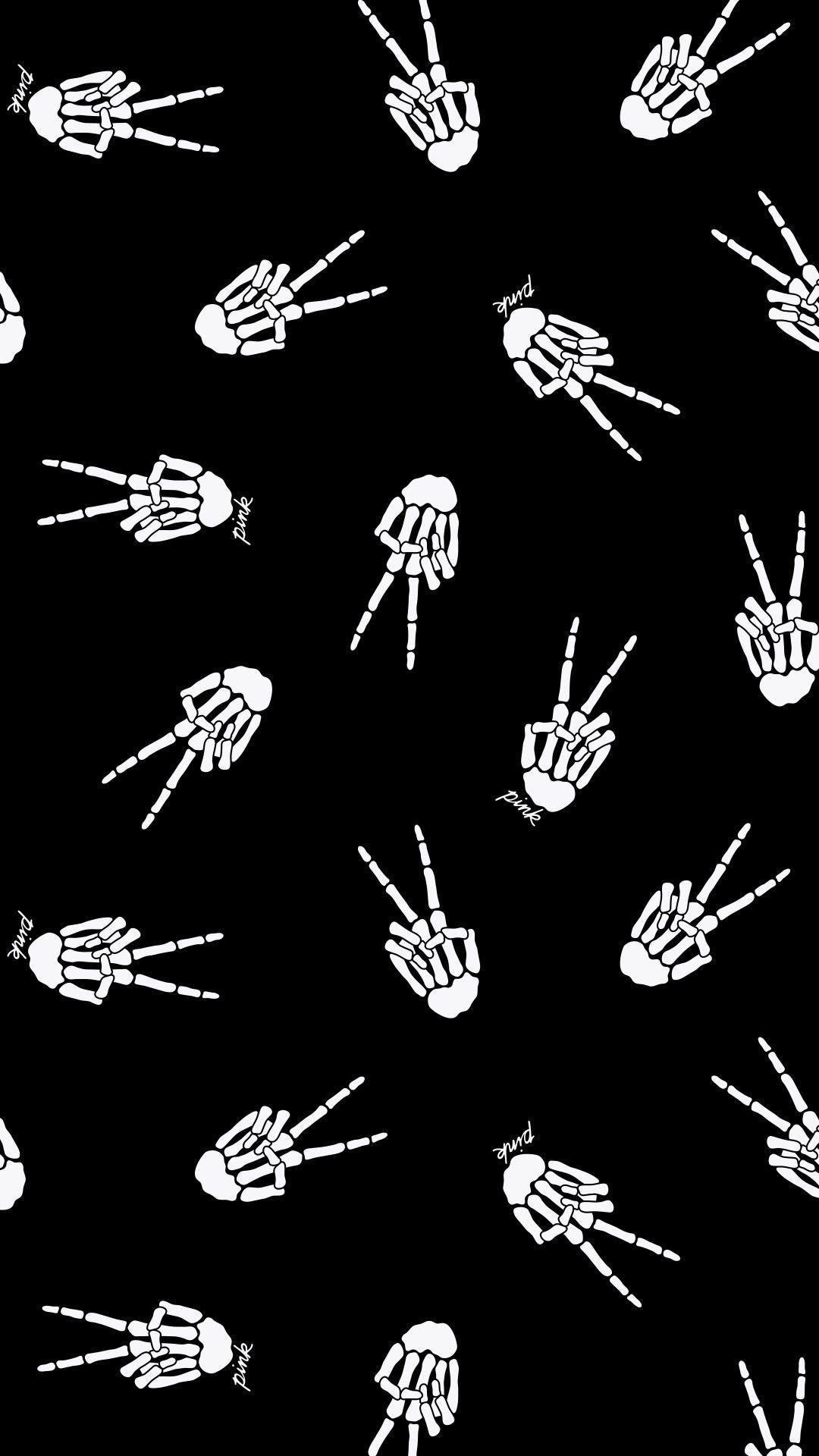 A pattern of white skeleton hands against a black background. Some of the hands are making the peace sign, some are making the middle finger gesture. - Halloween, ghost, gothic