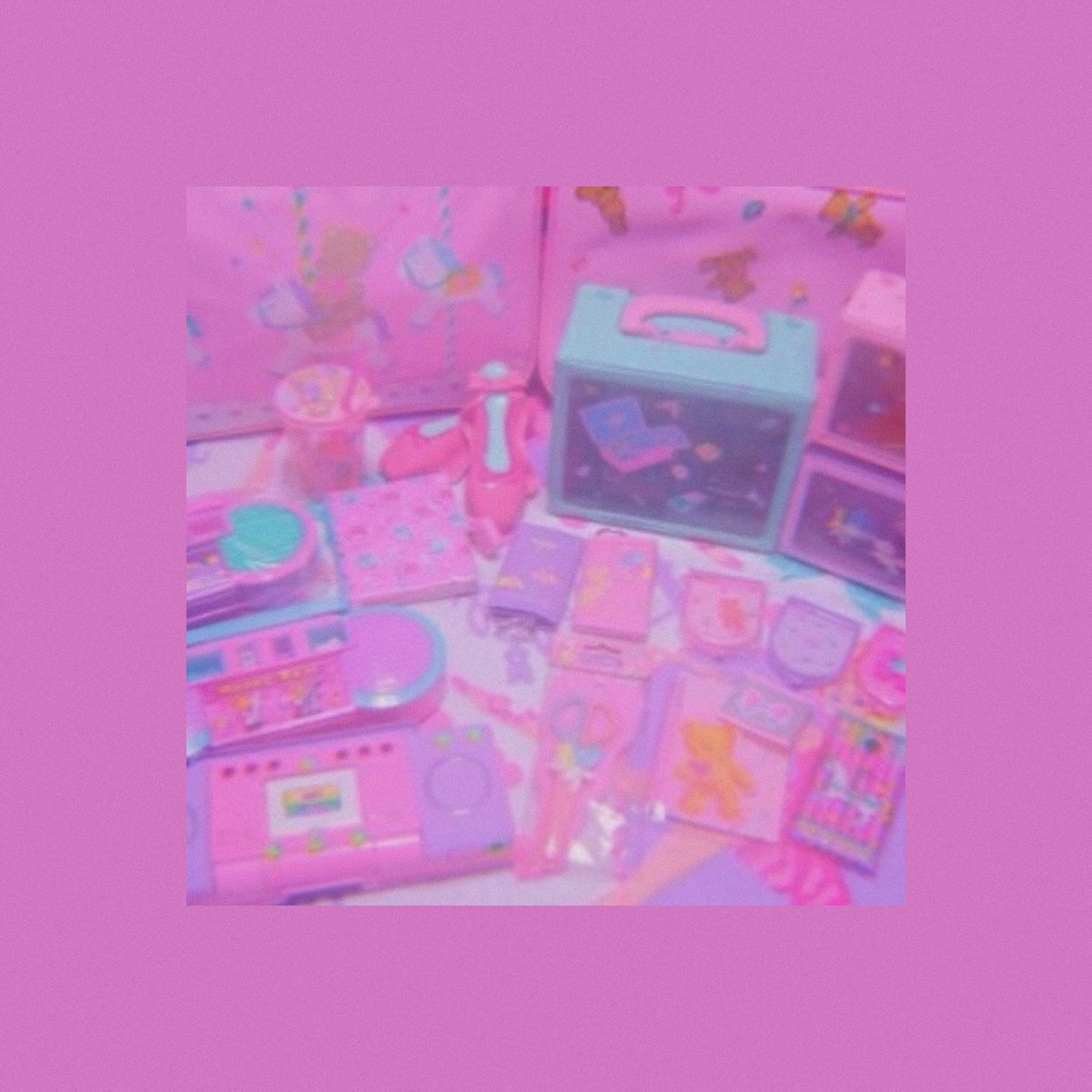A pink background with a collection of pink and blue toys - Scenecore