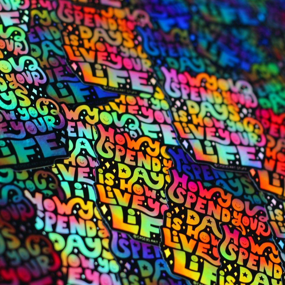 A close up of a colorful piece of art with words like 